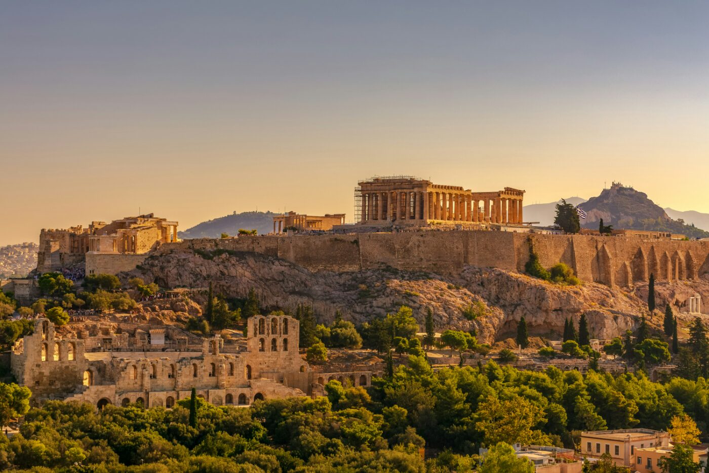 The Acropolis above Athens at sunset, with the Odeon of Herodes Atticus below